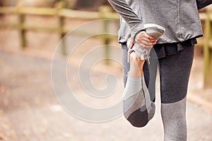 Love your body, keep it limber. an unrecognisable woman stretching before her workout in nature.