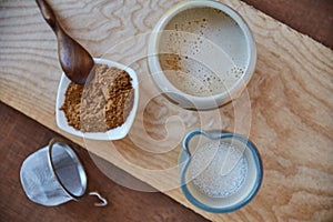 Love yourself enough to live a healthy lifestyle. Overhead shot of jugs of plant based milk and a ramekin of ground nuts