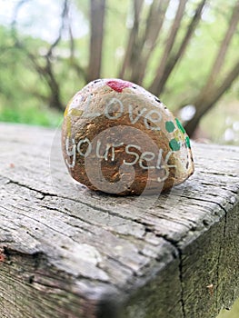 Love yourself wellbeing stone portrait