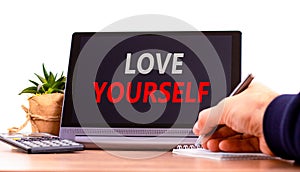 Love yourself symbol. Concept words Love yourself on beautiful black tablet. Beautiful white background. Calculator. Psychologist