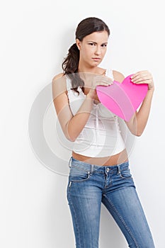 Lovelorn woman with paper heart