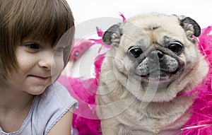 A lovely adorable young child with pug