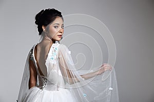 Lovely Asian Beautiful Woman bride in white wedding gown dress w