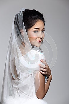 Lovely Asian Beautiful Woman bride in white wedding gown dress w