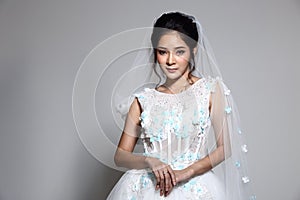 Lovely Asian Beautiful Woman bride in white wedding gown dress w