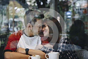 Lovely asian couple having coffee