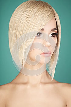 Lovely asian woman with blonde short hair