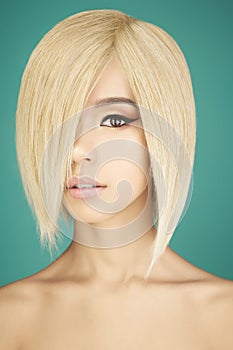 Lovely asian woman with blonde short hair