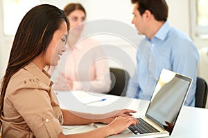 Lovely asiatic woman working on her laptop