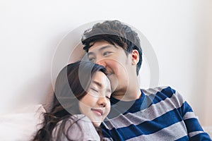 Lovely attractive young Asian smile couple man and woman with happy kiss and hug in romantic moment. Warm heart marriage and lover