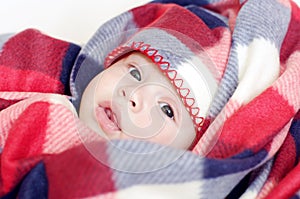 Lovely baby in checkered plaid