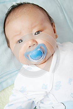 Lovely baby with pacifier