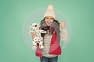 Lovely baby smiling face. Pets shop. Her favourite toy. Happy child hold soft toy. Little girl smile with toy dog