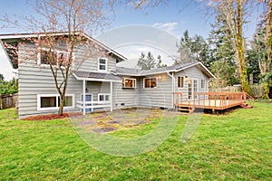 Lovely back yard with deck and grass.