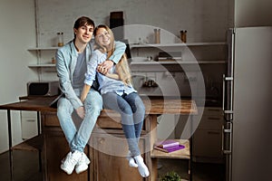 Lovely beautiful couple spending time together in the kitchen