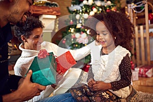 Lovely black child for Christmas with parents