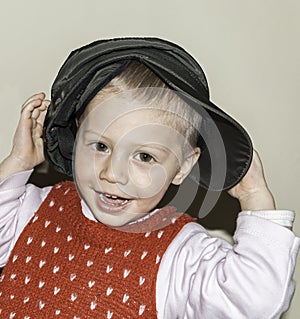 Blond child smiling to the camera photo