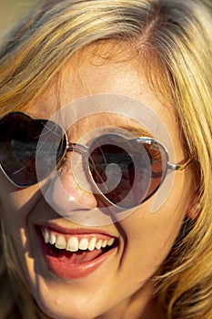 A Lovely Blonde Model Enjoys A Summers Day Outdoors At The Park