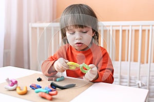 Lovely boy with playdough photo