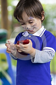 Lovely Boy Playing on Mobile Phone