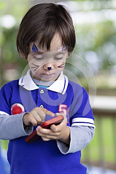 Lovely Boy Playing on Mobile Phone