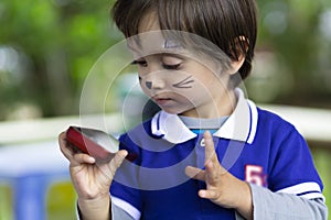 Lovely Boy Playing on Mobile Phone