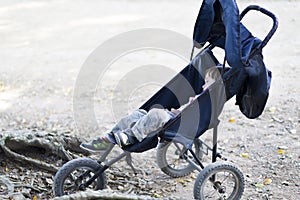 Lovely Boy Sleeping in Baby Stroller
