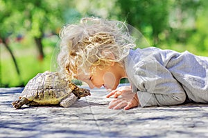 Lovely boy with turtle