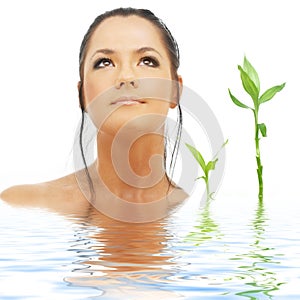 Lovely brunette with bamboo