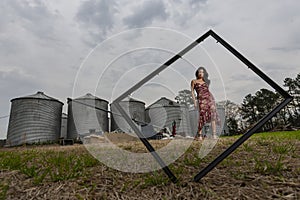 A Lovely Brunette Model Posing Outdoors With The Latest Fashions