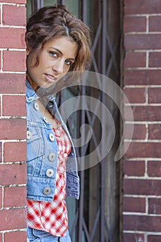 A Lovely Brunette Model Posing Outdoors With The Latest Fashions