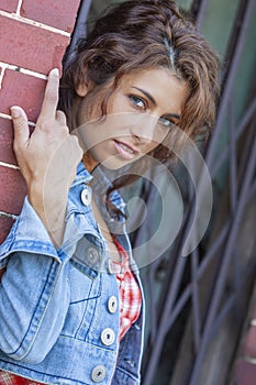 A Lovely Brunette Model Posing Outdoors With The Latest Fashions