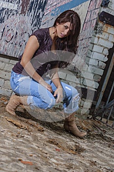 A Lovely Brunette Model Posing Outdoors With The Latest Fashions