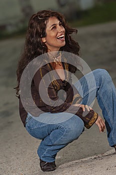 A Lovely Brunette Model Posing Outdoors With The Latest Fashions