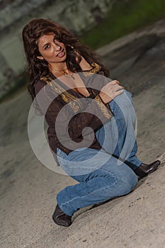 A Lovely Brunette Model Posing Outdoors With The Latest Fashions