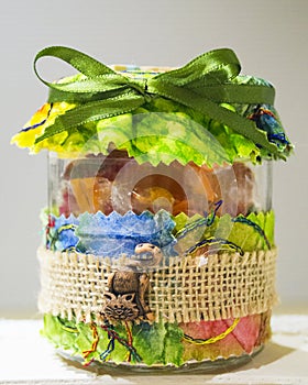 Lovely candies jar with a nice bright green ribbon and a ceramic kitty puppet