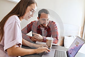 Lovely charming couple checking mail using computer