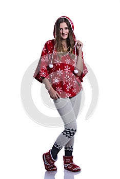 Lovely cheerful teenage girl posing in the studio. Wearing red winter hoodie with snowflakes. Isolated on white background.