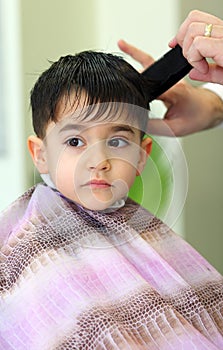 Lovely child at hairdresser