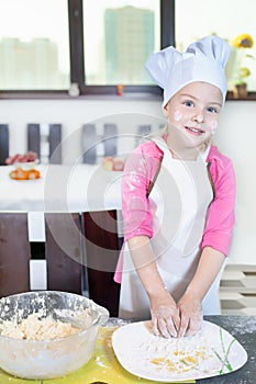 Lovely children preparing a cake