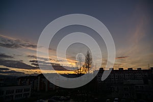 Lovely clouds over the city and houses or park and meadow, during sunrise or sunset.