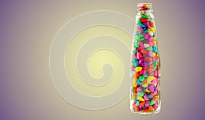 Lovely colorful small pebbles in a clear glass bottle with a light violet shaded