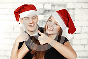 Lovely couple celebrating Christmas eve with present gifts