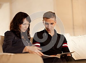 Lovely couple reading a book together