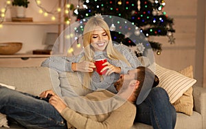 Lovely couple relaxing at home on Christmas