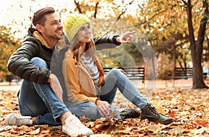 Lovely couple spending time together in park.