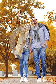 Lovely couple spending time together in park.