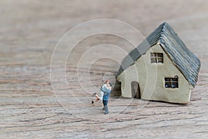 Lovely couple with success future house concept, small miniature