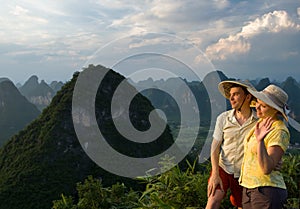 Lovely couple at sunset on top of the Chinese mountain of Moon Hill