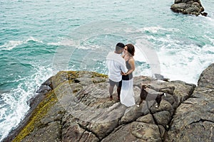 Lovely couple on tropical beach. Concept of just married lovers.